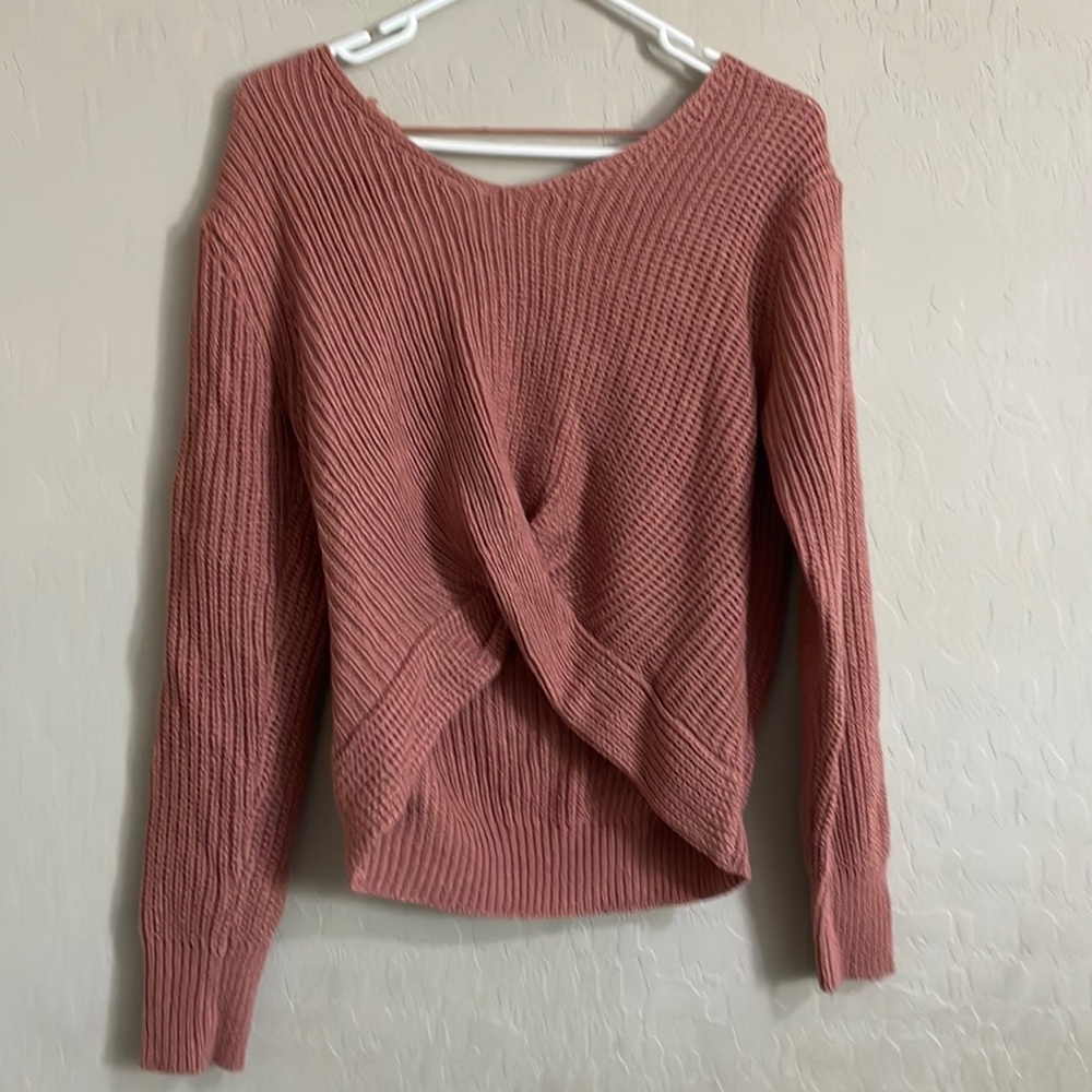 A sweater size large. The brand is proof apparel. The color is like brown pink.